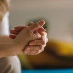 Close up shot of unrecognizable woman cracking her knuckles.