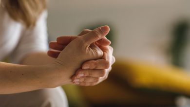 Close up shot of unrecognizable woman cracking her knuckles.