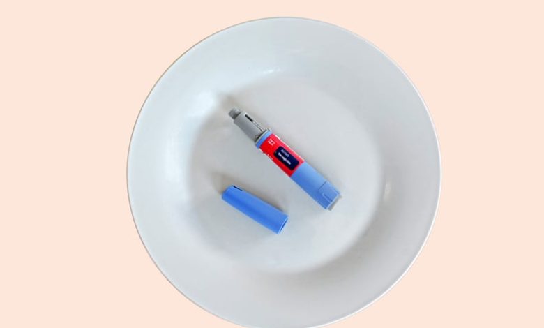 Semaglutide injecting  pen with lid on a white plate