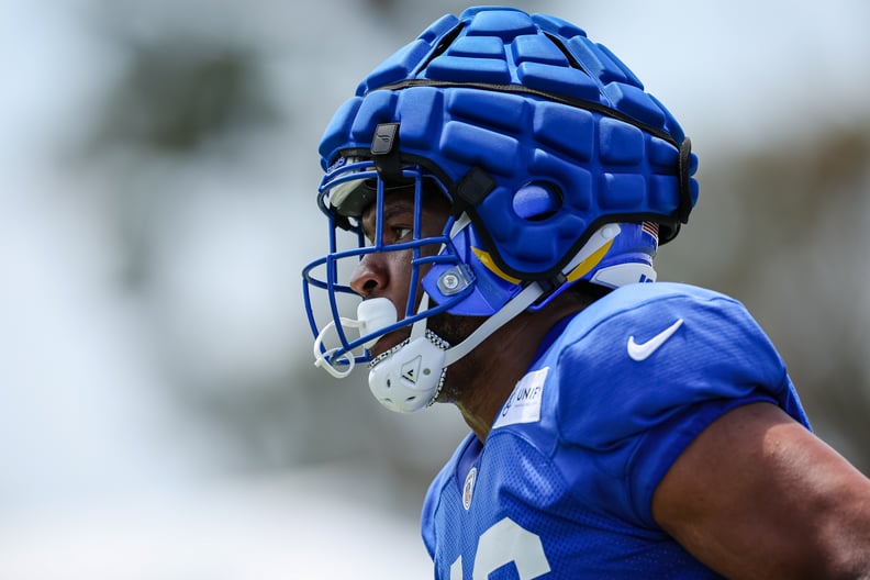 Jared Pinkney of the Los Angeles Rams participates in a drill while wearing a Guardian Cap during training camp.