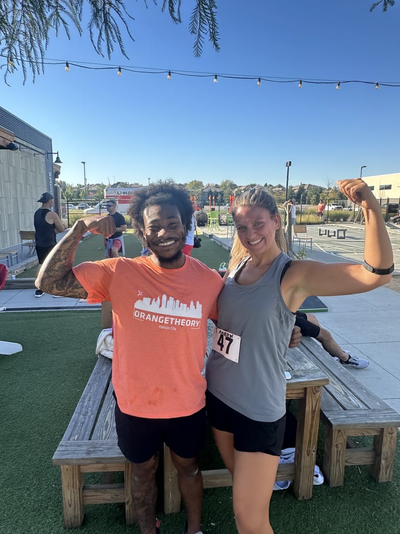 Image of Taylor Andrews With an Orange Theory Coach at DriTri Event Outside