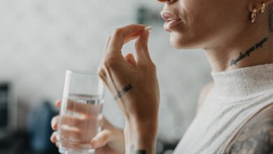 Woman medicating herself at home medicine.