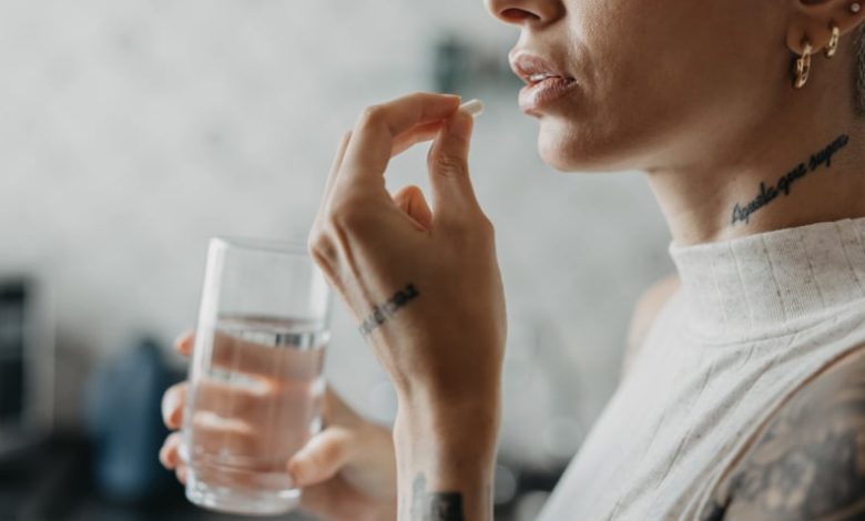 Woman medicating herself at home medicine.