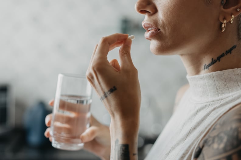 Woman medicating herself at home medicine.