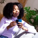 Woman drinks tea for anxiety.