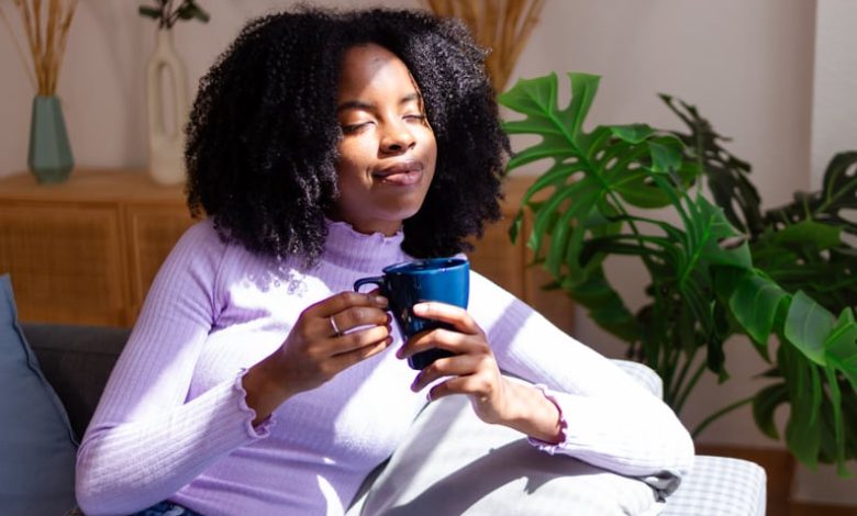 Woman drinks tea for anxiety.