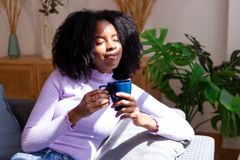 Woman drinks tea for anxiety.