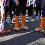 Runners wear turkey costumes at Turkey Trot in Denver, Colorado