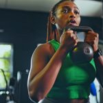 Woman holding a kettlebell in the gym during a CrossFit workout