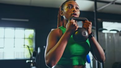 Woman holding a kettlebell in the gym during a CrossFit workout