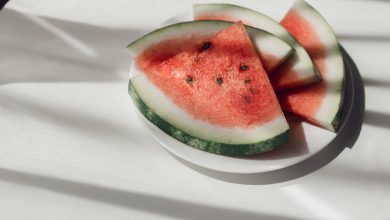 Watermelon slices on white plate on the table to represent the health benefits of watermelon