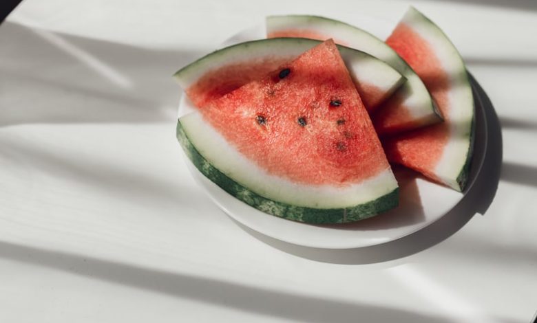 Watermelon slices on white plate on the table to represent the health benefits of watermelon