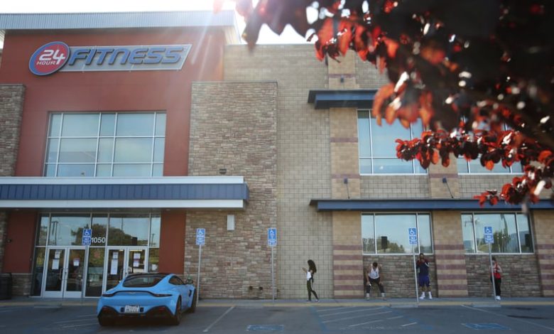 People outside the 24 Hour Fitness/Redwood City Super Sport in Redwood City, Calif