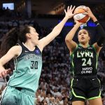 Napheesa Collier #24 of the Minnesota Lynx shoots the ball against Breanna Stewart #30 of the New York Liberty.