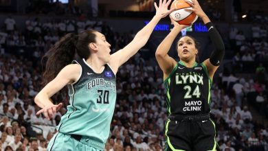 Napheesa Collier #24 of the Minnesota Lynx shoots the ball against Breanna Stewart #30 of the New York Liberty.